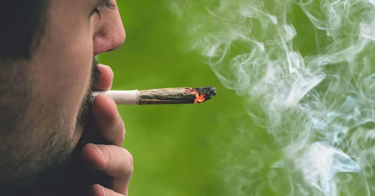 Man smoking a cannabis joint